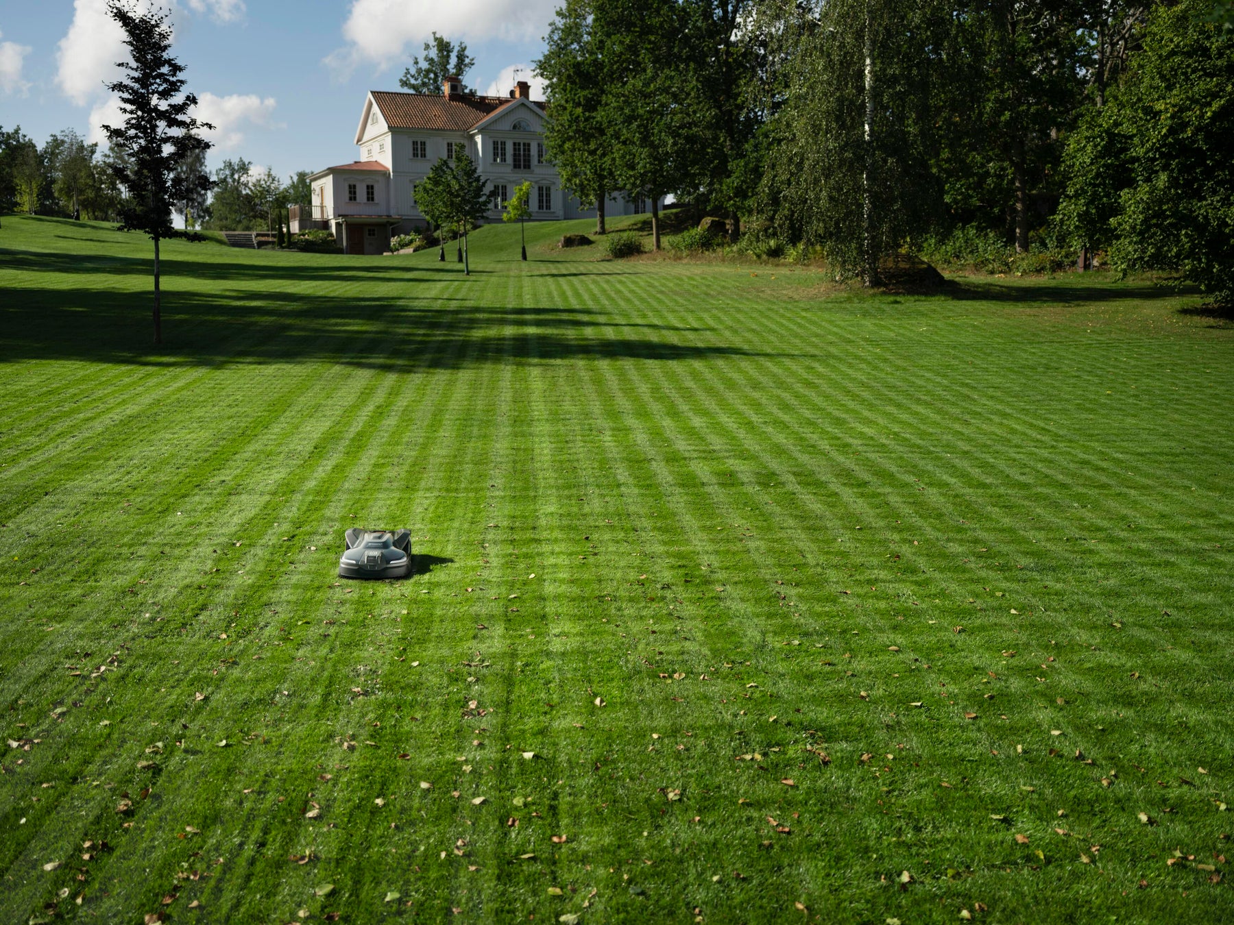 Husqvarna Automower® robotic mower on a residential lawn